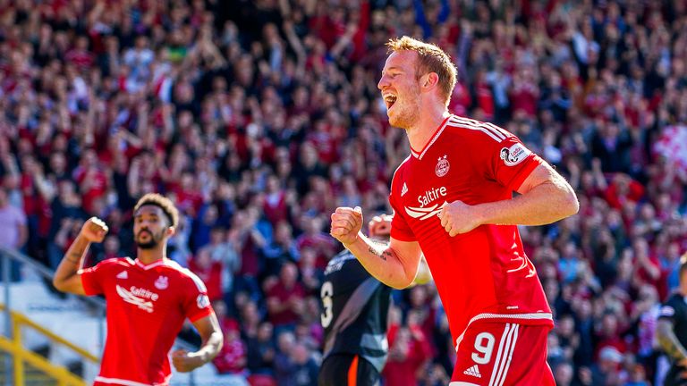 Adam Rooney wheels away to celebrate his penalty for Aberdeen against Kilmarnock.