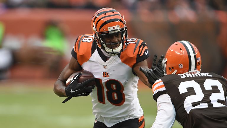 A.J. Green #18 of the Cincinnati Bengals carries the ball in front of Buster Skrine #22 of the Cleveland Browns