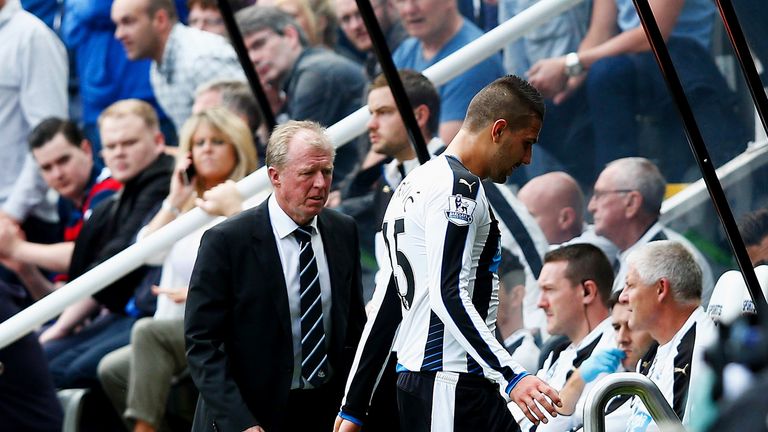 Aleksandar Mitrovic (C) of Newcastle United walks past Steve McClaren manager of Newcastle United while leaving 