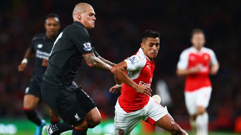 Alexis Sanchez of Arsenal is closed down by Liverpool's Martin Skrtel 