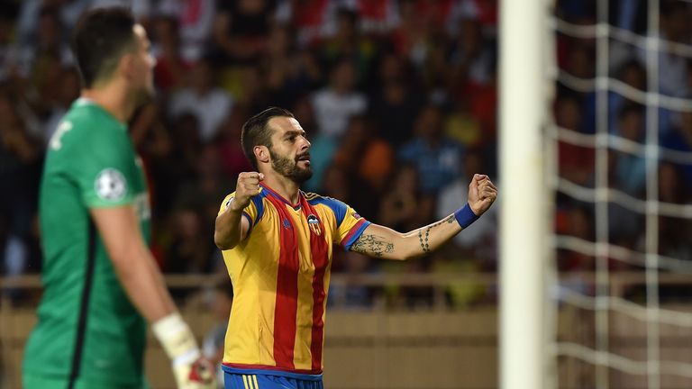 MONACO - AUGUST 25:  Alvaro Negredo (C) of Valencia celebrates after scoring the opening goal during the UEFA Champions League qualifying round play off se