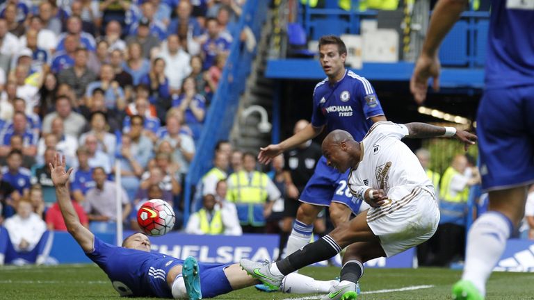 Swansea City's Ghanaian striker Andre Ayew scores an equalising goal to take the score to 1-1 during the English Premier League football match v Chelsea 