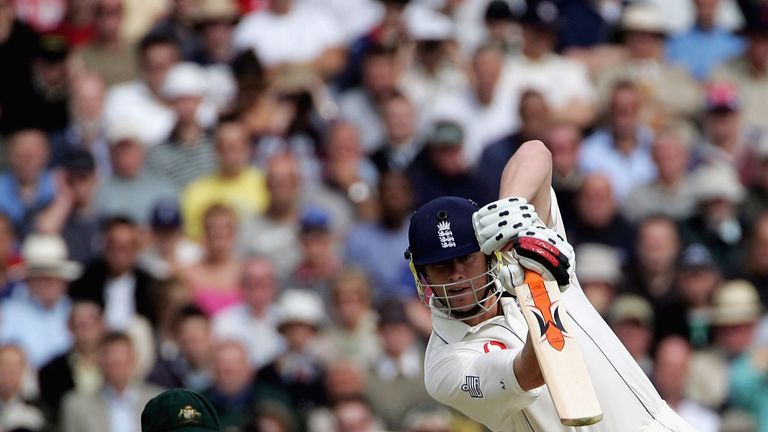 NOTTINGHAM, UNITED KINGDOM - AUGUST 26:  Andrew Flintoff of England hits out as Adam Gilchrist of Australia watches on during day two of the Fourth npower 