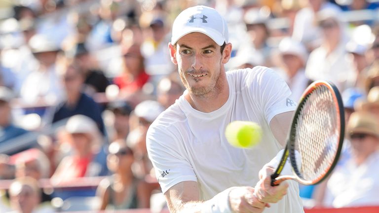 Andy Murray of Great Britain hits a return against Novak Djokovic of Serbia during the final of the Rogers Cup in Montreal