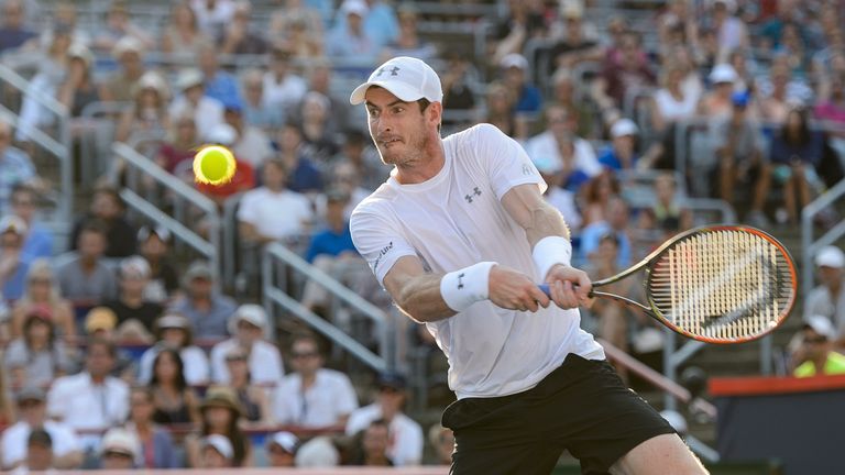MONTREAL, ON - AUGUST 16:   Andy Murray of Great Britain hits a return against Novak Djokovic of Serbia during day seven of the Rogers Cup at Uniprix Stadi