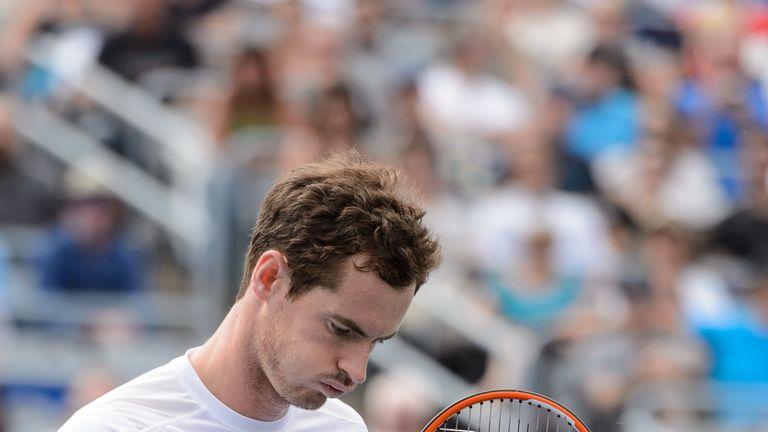 Andy Murray of Great Britain reacts after scoring a point on Gilles Muller of Luxembourg during day four of the Rogers Cup at the Montreal Masters