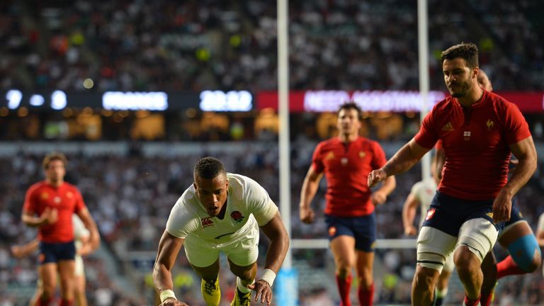 England wing Anthony Watson (C) scores his second try during the World Cup warm-up match against France at Twickenham