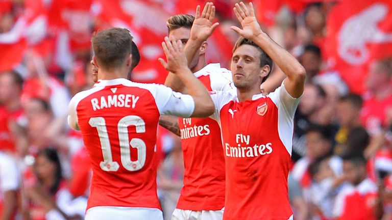 Arsenal players celebrate in front of their supporters at the final whistle during the FA Community Shield football 