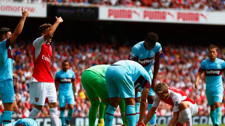 Players call for medical assistance as Olivier Giroud