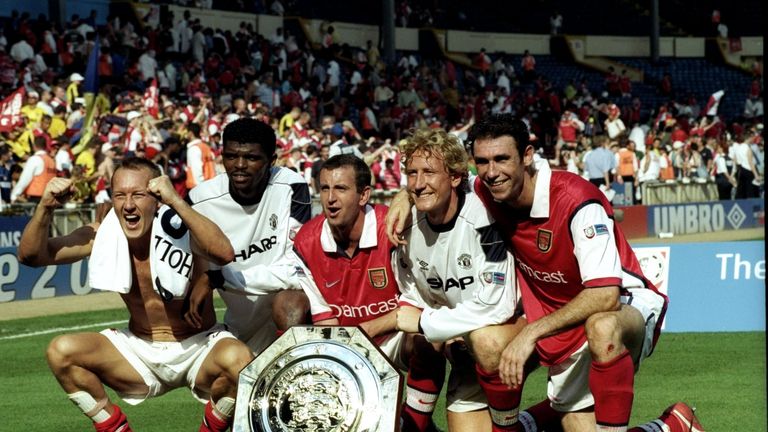 Nigel Winterburn (centre) and Martin Keown (right) celebrate winning the 1999 Community Shield