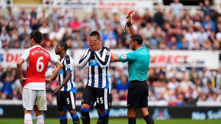 Aleksandar Mitrovic (2nd R) of Newcastle United is shown a red card by referee Andre Marriner (1st R)