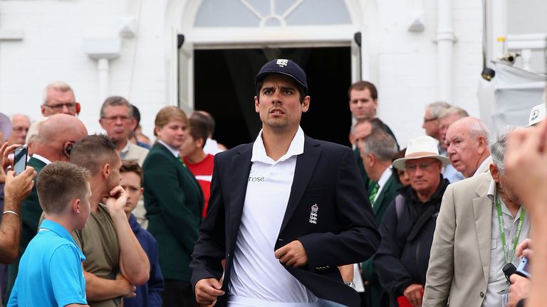 Alastair Cook of England walks out for the toss 