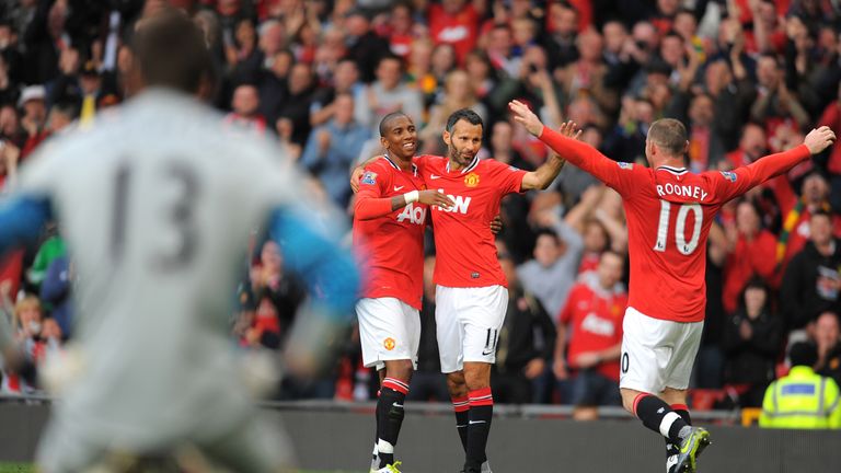 Ashley Young, Ryan Giggs and Wayne Rooney celebrate during Manchester United's 8-2 win over Arsenal
