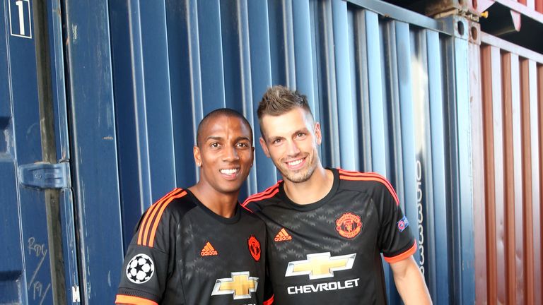 Ashley Young (R) and Morgan Schneiderlin of Manchester United pose at the official launch of the Manchester United third kit in Marseille