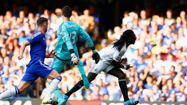 Bafetimbi Gomis is brought down by Thibaut Courtois