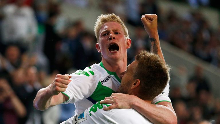 Nicklas Bendtner of VfL Wolfsburg celebrates scoring his teams first goal of the game with team mate Kevin De Bruyne during the DFL Supercup