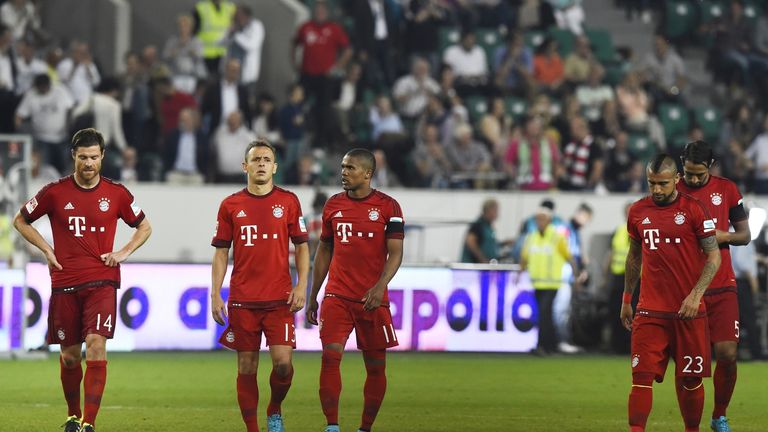 Bayern Munich's players react after the penalties of the German Super Cup football match VfL Wolfsburg vs Bayern Munich in Wolfsburg, central Germany