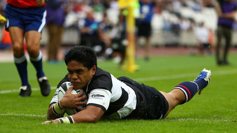 Ben Tapuai of The Barbarians dives over for a try against Samoa