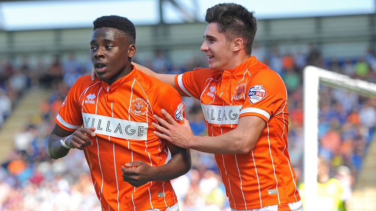 Blackpool's Bright Osayi-Samuel (left) and Henry Cameron celebrate after their side's first goal against Colchester