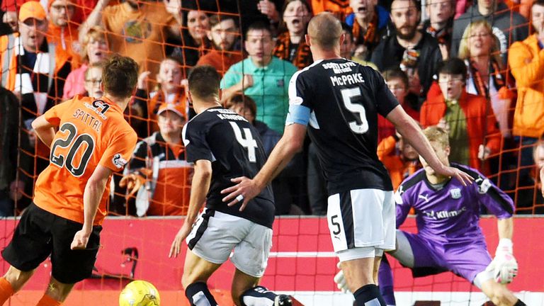 Blair Spittal scores the first goal in the Dundee derby at Tannadice