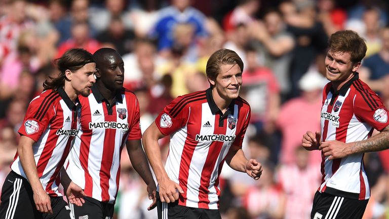 BRENTFORD, ENGLAND - AUGUST 08:  James Tarkowski (2nd R) of Brentford celebrates scoring his side's second goal during the Sky Bet Championship match betwe