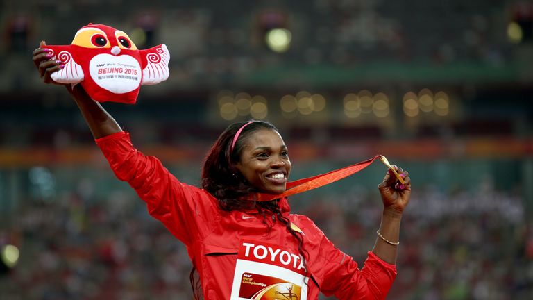 Caterine Ibarguen proudly displays her triple jump gold medal