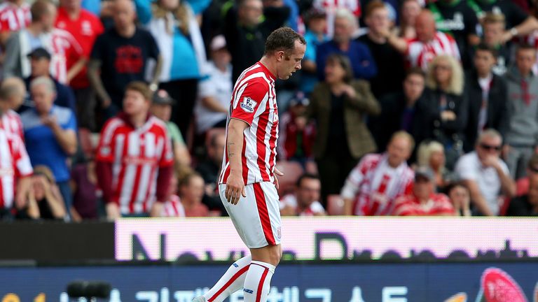 Charlie Adam walks off the pitch after being shown a red card - Stoke down to 9 men against West Brom