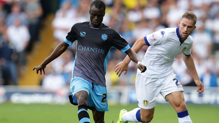 Liam Palmer of Sheffield Wednesday maintainls control over Charlie Taylor