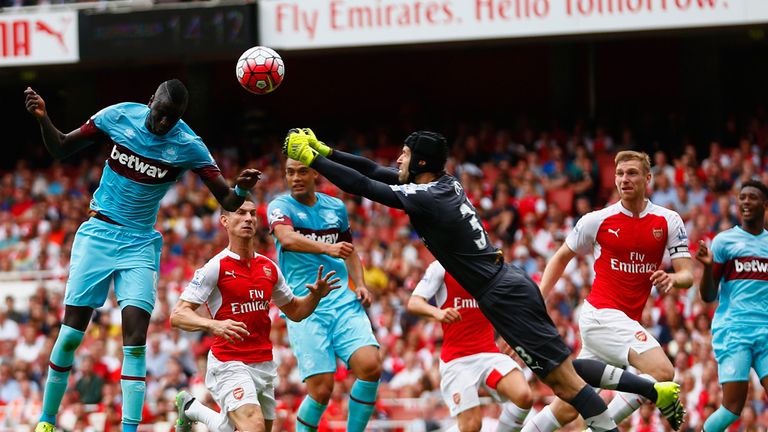 Petr Cech of Arsenal fails to punch clear as Cheikhou Kouyate heads home