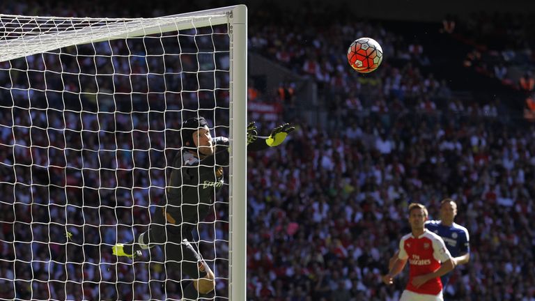 Petr Cech (L) makes a save from a free-kick