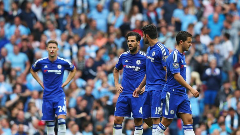 Cesc Fabregas of Chelsea looks dejected with team-mates after the third Manchester City goal, Premier League