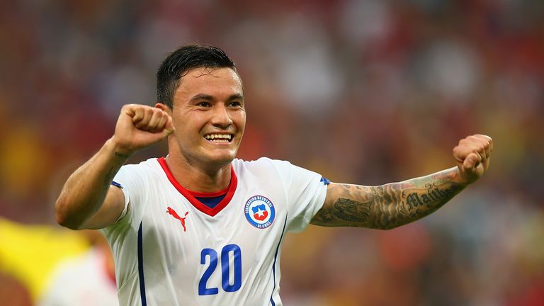Charles Aranguiz of Chile celebrates scoring against Spain during the 2014 FIFA World Cup. 