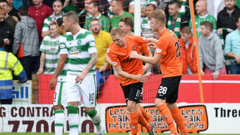 Dundee United's Chris Erskine (11) celebrates his penalty against Celtic.