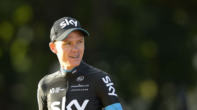 Tour de France 2015's winner Great Britain's Christopher Froome arrives at the podium on the Champs-Elysees avenue in Paris