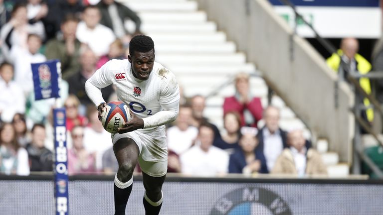 England's right wing Christian Wade runs to score a try during the International rugby union match between Barbarians and England at Twickenham Stadium