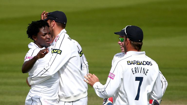 HOVE, ENGLAND - JUNE 08: Fidel Edwards of Hampshire celebrates with team mates after taking the wicket of Matthew Machan of Sussex  during day two of the L