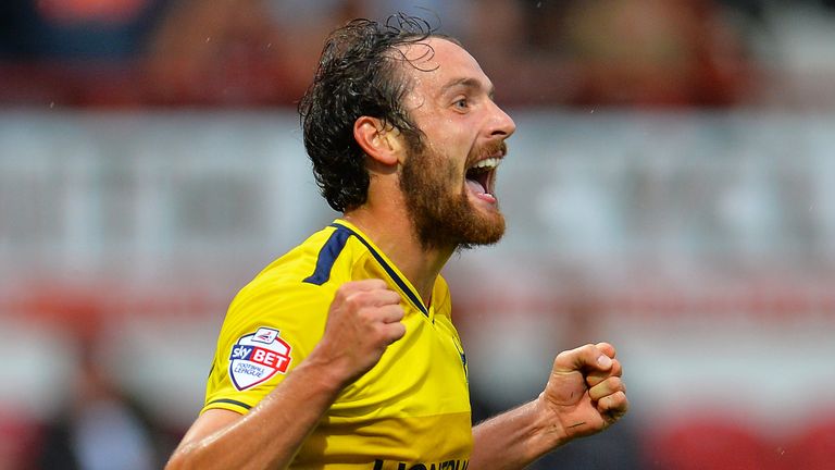 Danny Hylton of Oxford United celebrates scoring Oxfords 2nd goal during the Capital One Cup match between Brentford and Oxford United at Griffin Park
