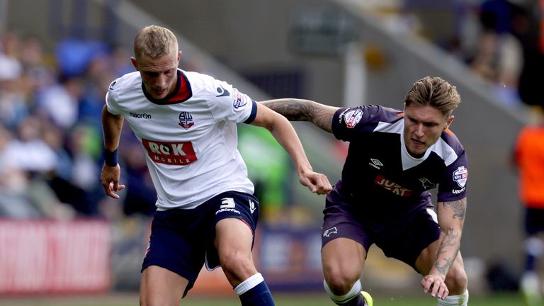 BOLTON, ENGLAND - AUGUST 8:  Dean Moxey (L) of Bolton Wanderers and Jeff Hendrick of Derby County battle for the ball during the Sky Bet Championship match