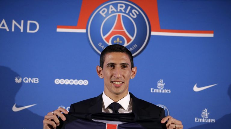 Angel Di Maria poses with his PSG jersey during his official presentation in Paris.