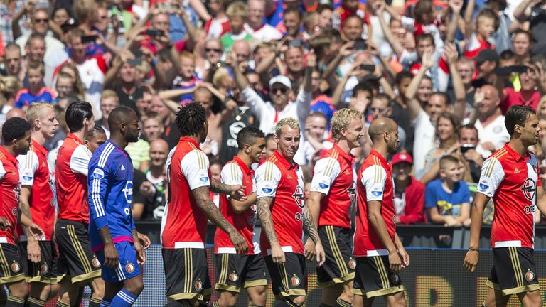 Feyenoord players, including Dirk Kuyt, walk on the pitch during the team's presentation to supporters on an Open Day at De Kuip on July 19, 2015