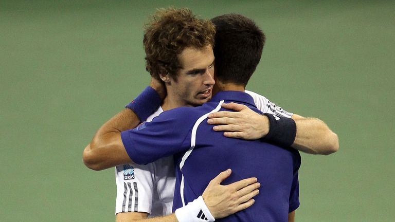NEW YORK, NY - SEPTEMBER 10:  Andy Murray of Great Britain hugs Novak Djokovic of Serbia following his victory in the men's singles final match on Day Fift