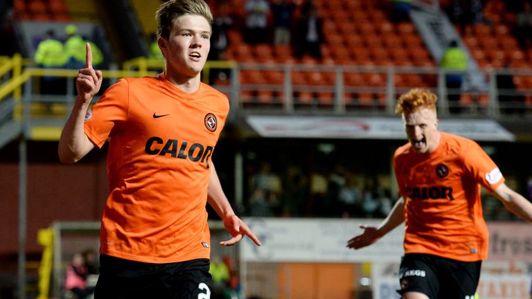 Dundee United's Blair Spittal wheels away after scoring a second