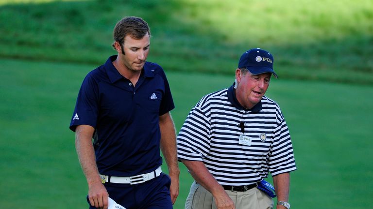 An official makes Johnson aware of his Championship-ending penalty