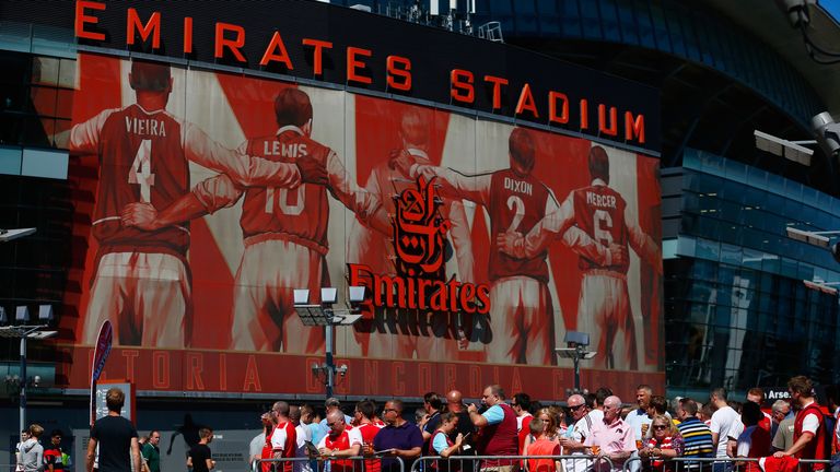 Fans wait outside the Emirates prior to the match between Arsenal and West Ham