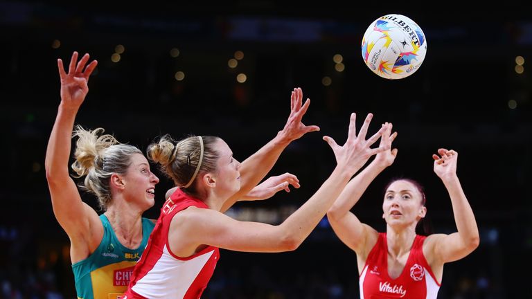 Laura Geitz Of Australia competes for the ball with Joanne Harten of England as she catches a pass from Jade Clarke