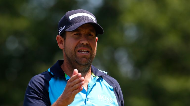 Erik Compton walks up the third hole during the second round of the Wyndham Championship at Sedgefield.