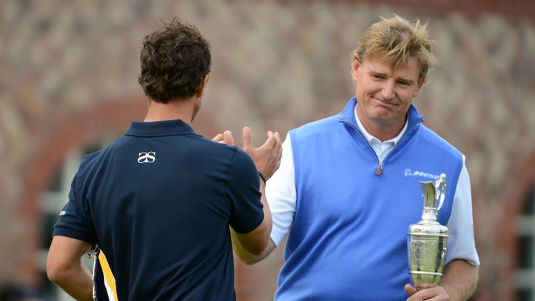 LYTHAM ST ANNES, ENGLAND - JULY 22:  New Open Champion Ernie Els of South Africa shakes hands with runner up Adam Scott of Australia 