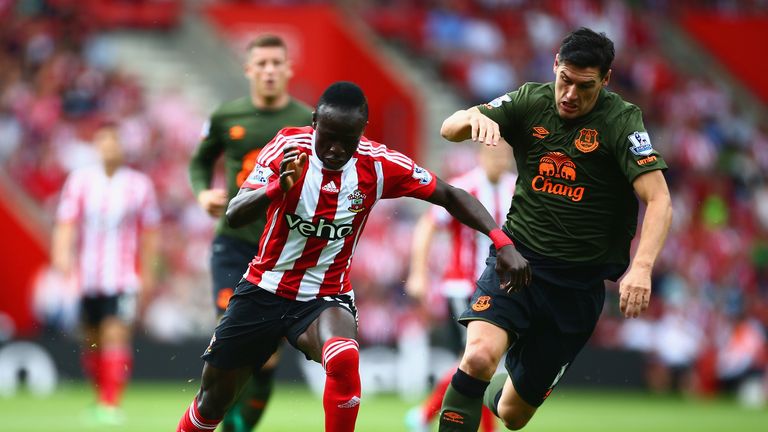 Sadio Mane of Southampton and Gareth Barry of Everton compete for the ball