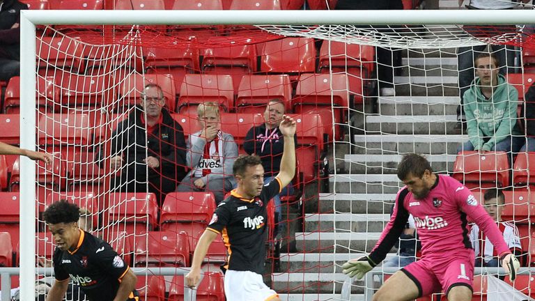 Exeter City's goalkeeper Bobby Olejnik can't do anything to prevent Jack Rodwell's shot going between his legs