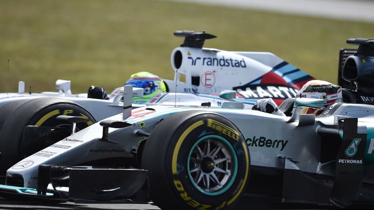 Felipe Massa and Lewis Hamilton battle